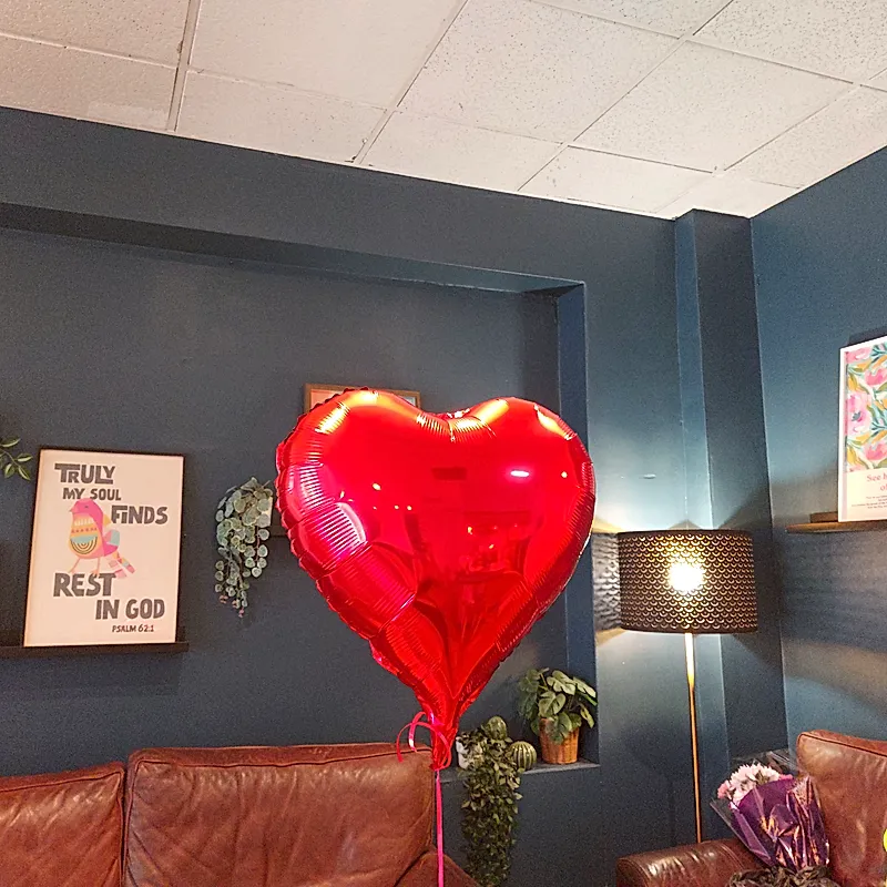 Heart balloon in a cosy lounge area